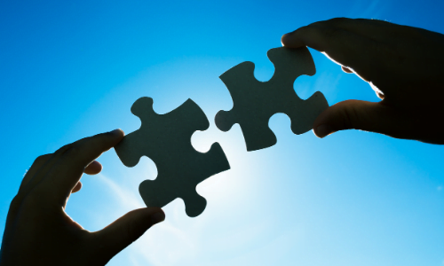 Two interlinking puzzle pieces