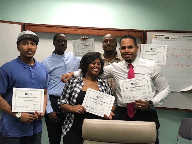 Business Owners showing their certificates