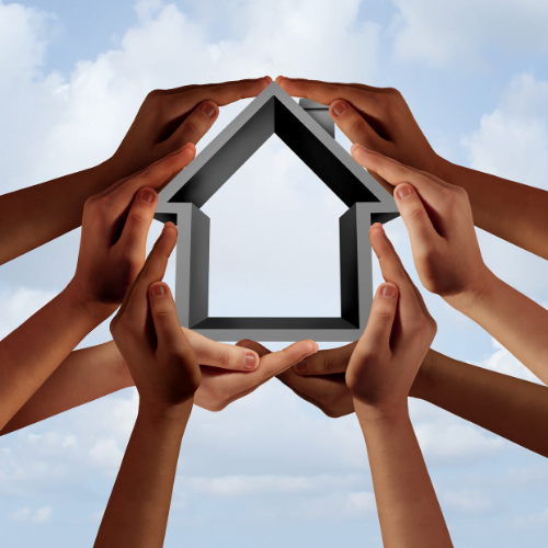 stock image of hands holding a house