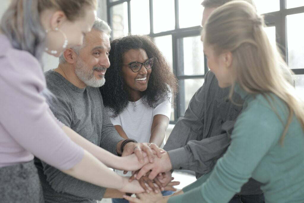People with their hands together