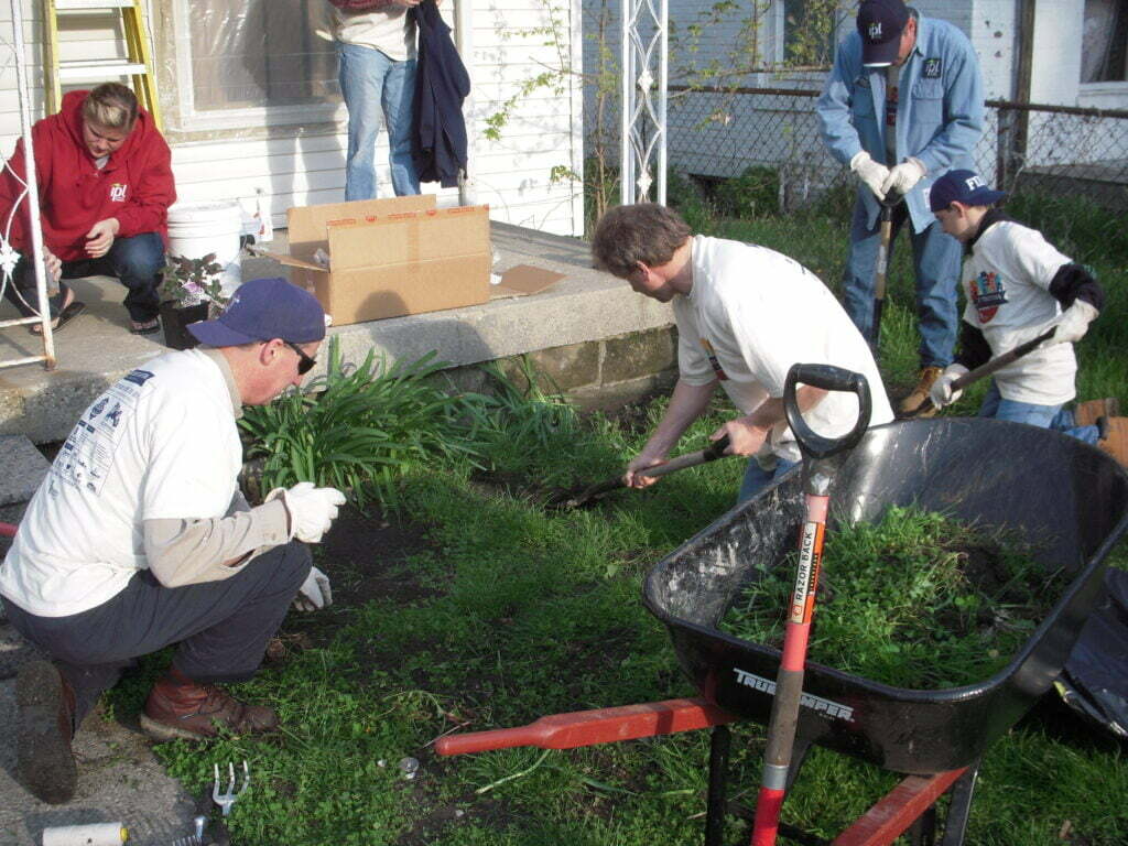 Workers digging ground on a new home